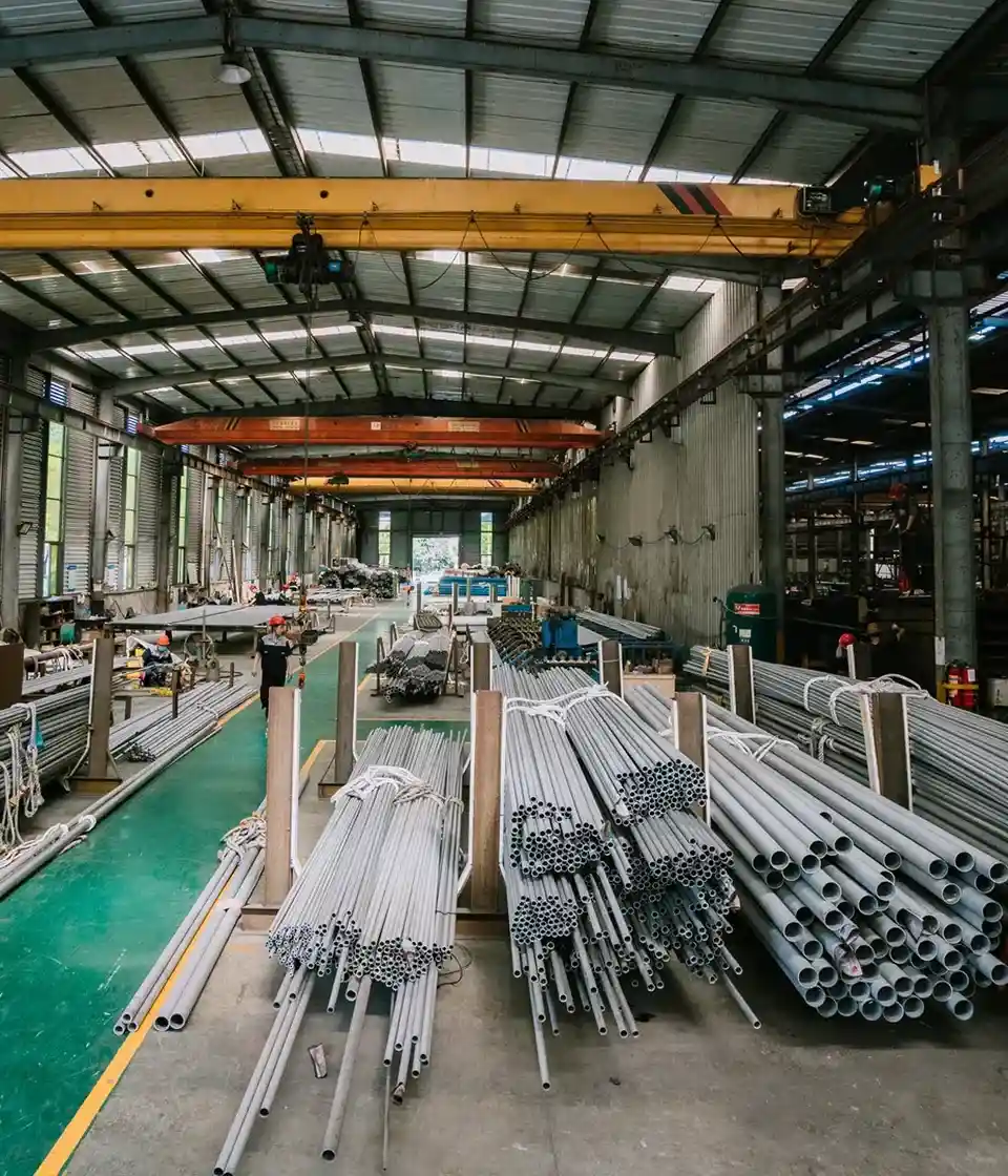 Bundles of seamless stainless steel tubes stacked inside the Thaida production hall