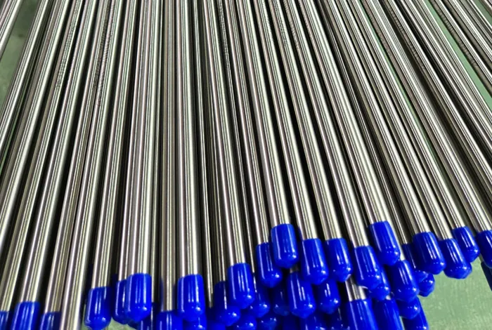 Polished stainless steel pipes with protective end caps